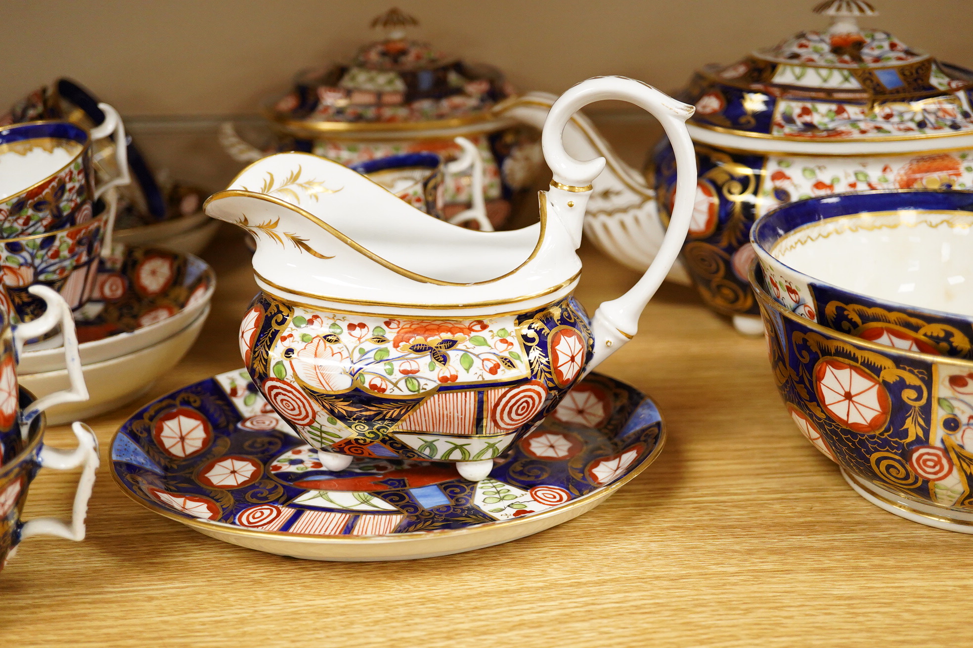 A 19th century Derby Imari pattern part tea set including a teapot a pair of 19th century botanical dishes and six small ironstone dishes.